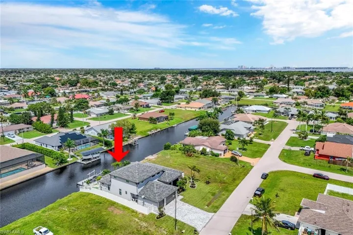 Aerial view of residential area with a large body of water