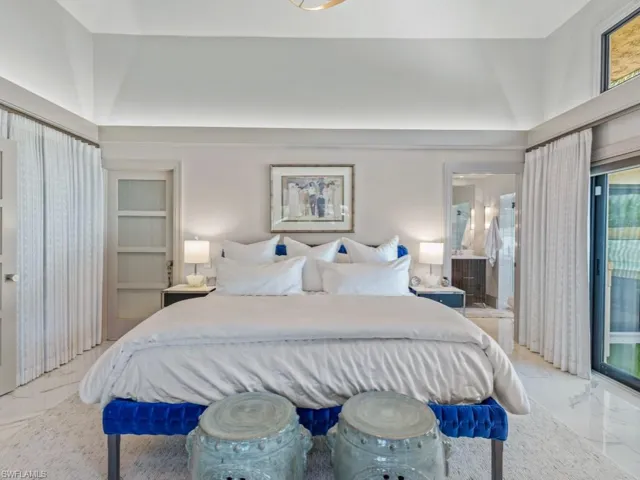 Primary bedroom with sliders to cocktail spa
