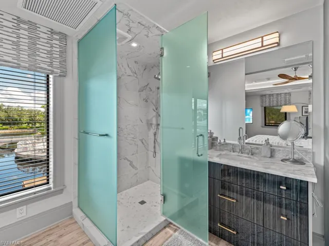 Second floor guest bath featuring opaque glass enclosures