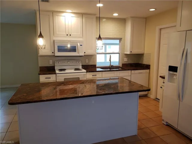 Kitchen work area with door to garage