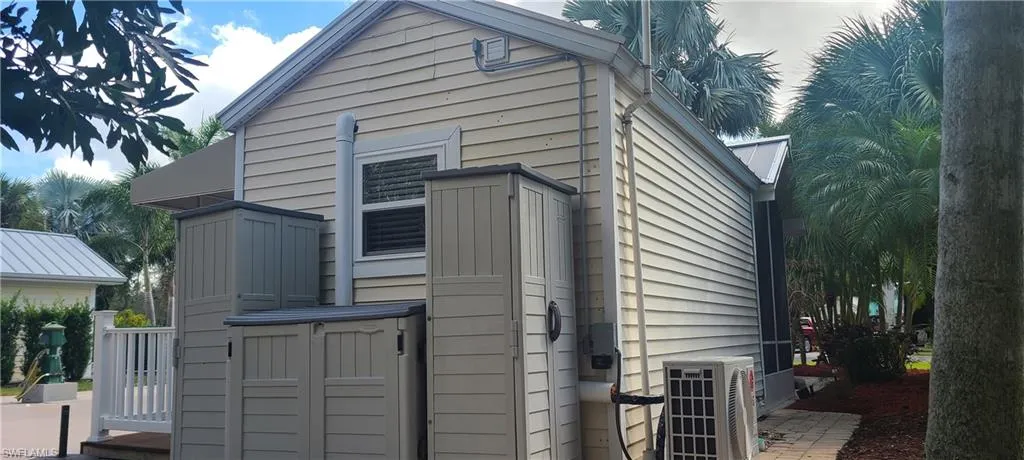 View of side of property featuring central AC