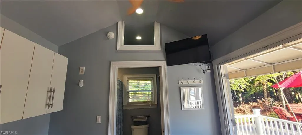 Entryway featuring lofted ceiling and a wealth of natural light