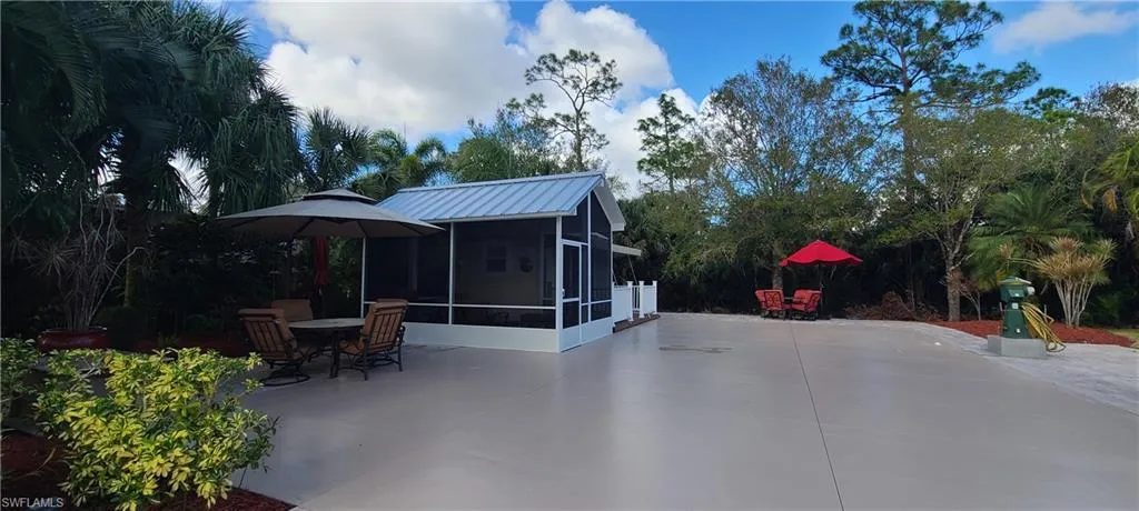 View of patio / terrace featuring a sunroom