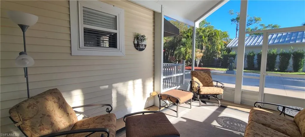 Sunroom featuring vaulted ceiling