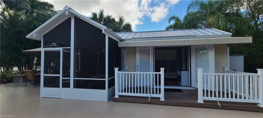 View of front facade featuring a sunroom