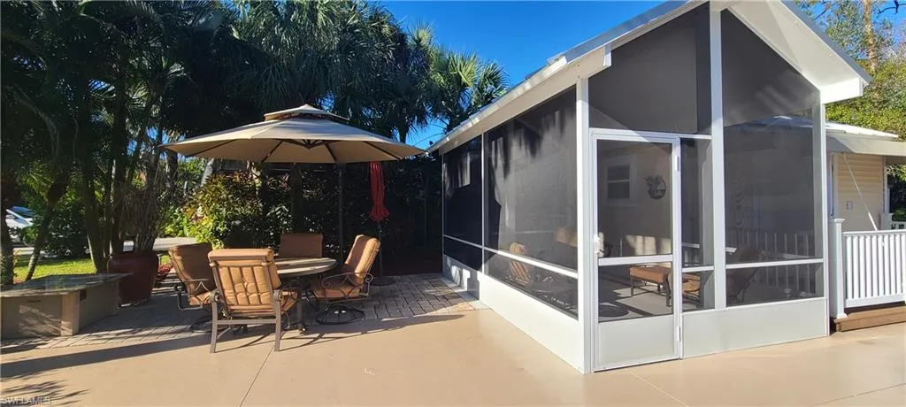 View of patio / terrace with a sunroom