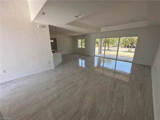 Spare room featuring tile