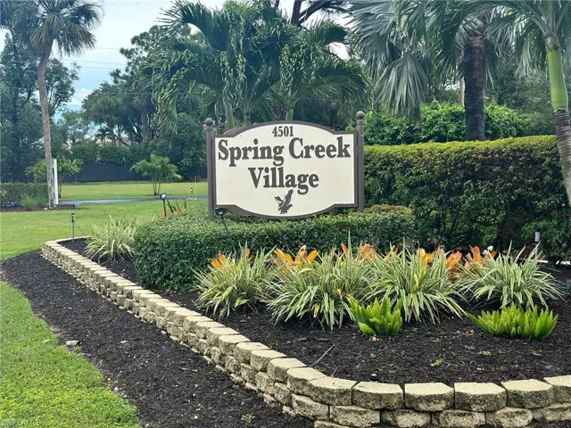 Community sign featuring a lawn