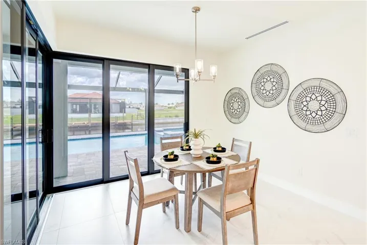 Dining space with a modern designed chandelier.