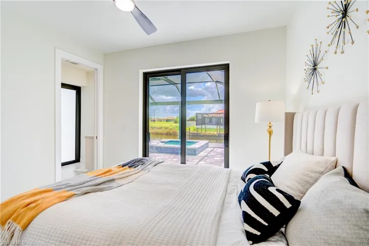 Bedroom with access to outside and ceiling fan