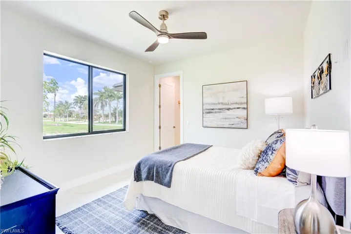 Bedroom featuring carpet and ceiling fan