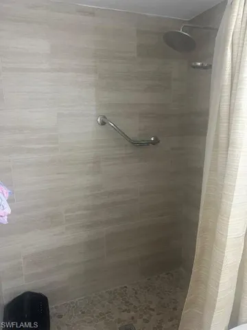 Full bath with a shower stall