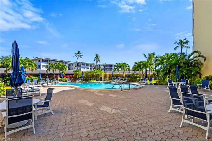 Community pool featuring a patio