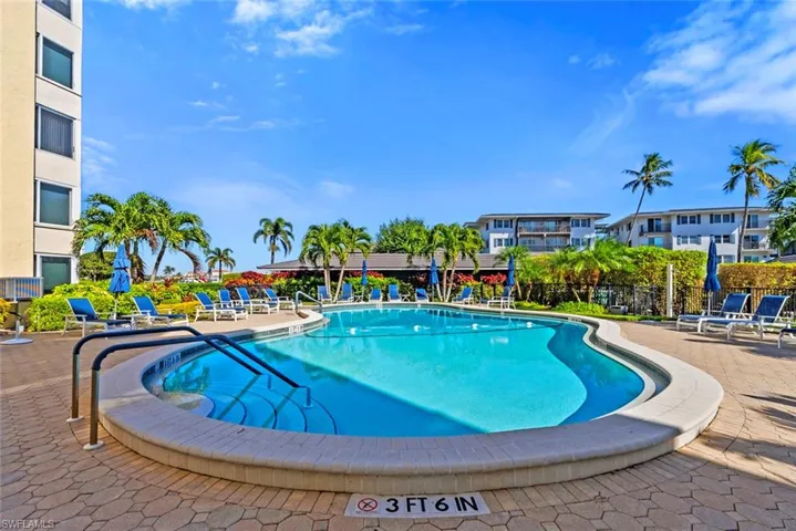 Community pool with a patio area