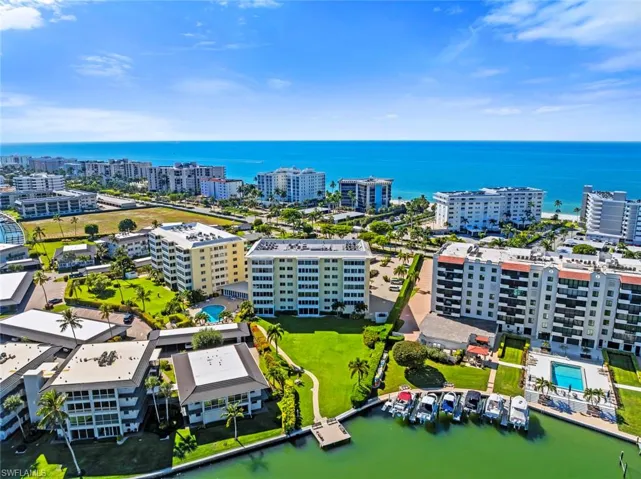 View of urban area with a large body of water and apartment complex