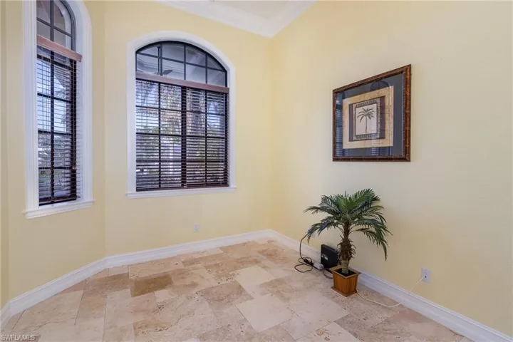 Den immediately off foyer with crown molding