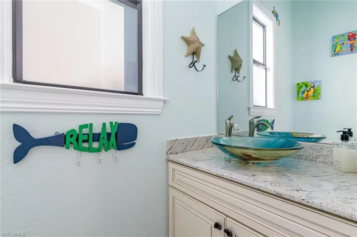 Pool Bath featuring vanity with unique sink