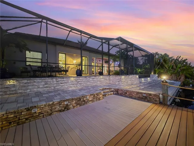 Deck at dusk with screen enclosure patio and lanai
