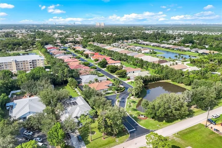 Pine into Estero Verde, looking SW w/inviting pond and lush vegetation at from gate