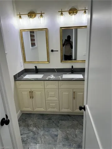 Bathroom featuring double vanity