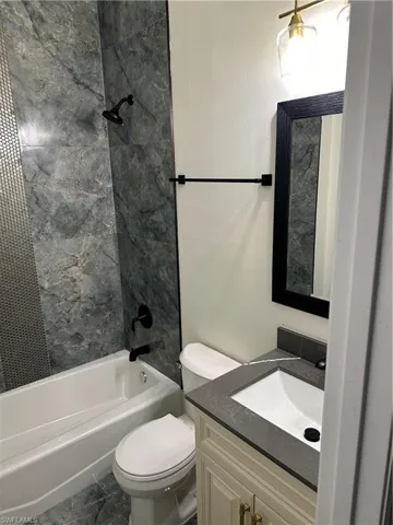 Full bath with shower / tub combination and vanity