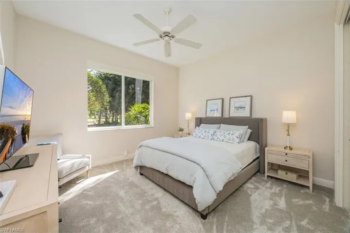 Bedroom featuring carpet and ceiling fan