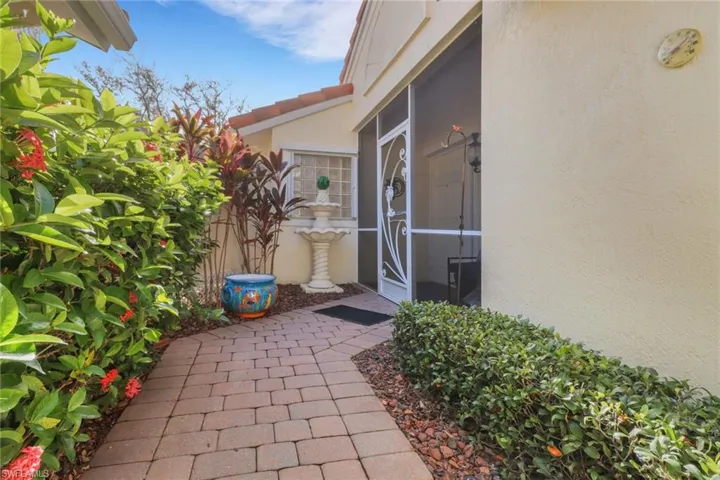 View of exterior entry featuring a patio