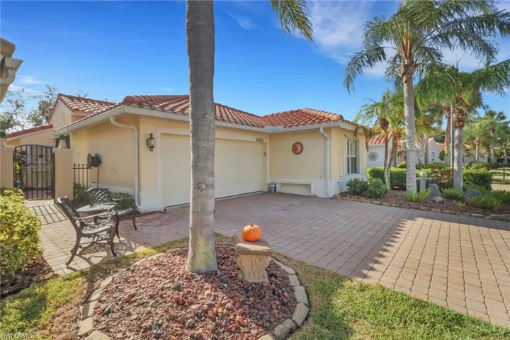 Rear view of property with a garage