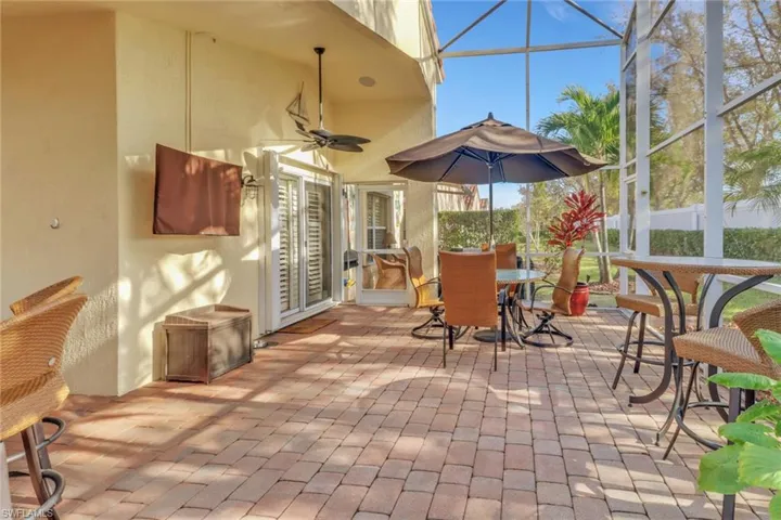 Sunroom / solarium featuring ceiling fan