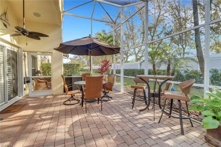 View of patio / terrace with a lanai and ceiling fan