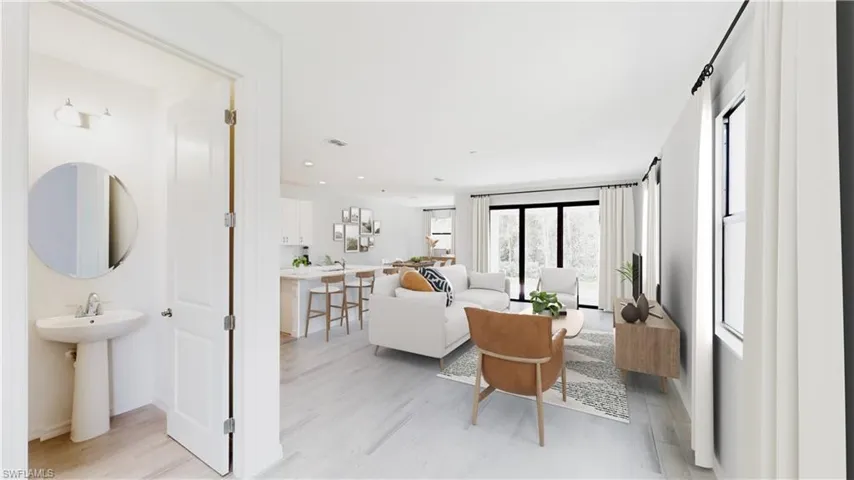 Model Home Virtually staged Living area featuring light wood-type flooring