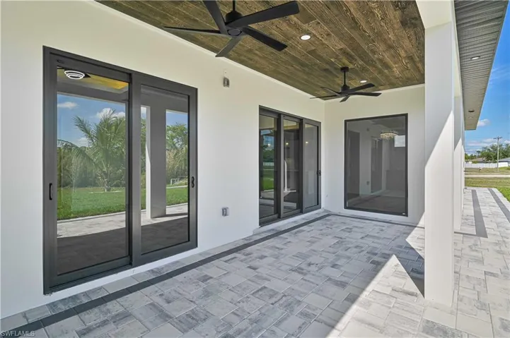 View of patio featuring ceiling fan