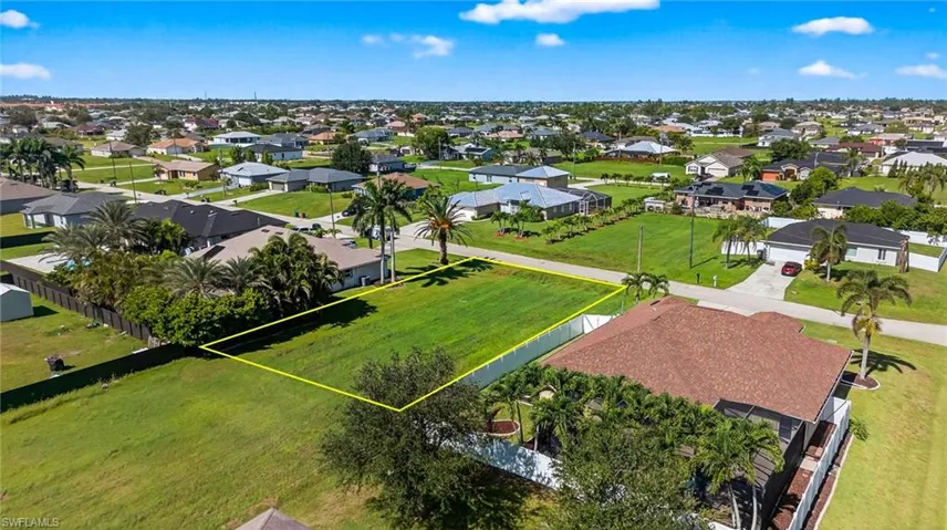 Aerial perspective of suburban area featuring property parcel outlined