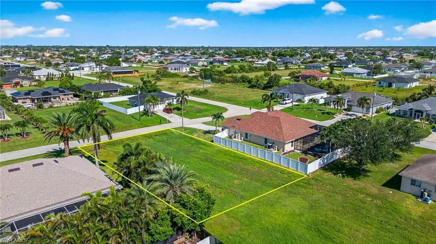 Aerial view of residential area with property boundaries highlighted