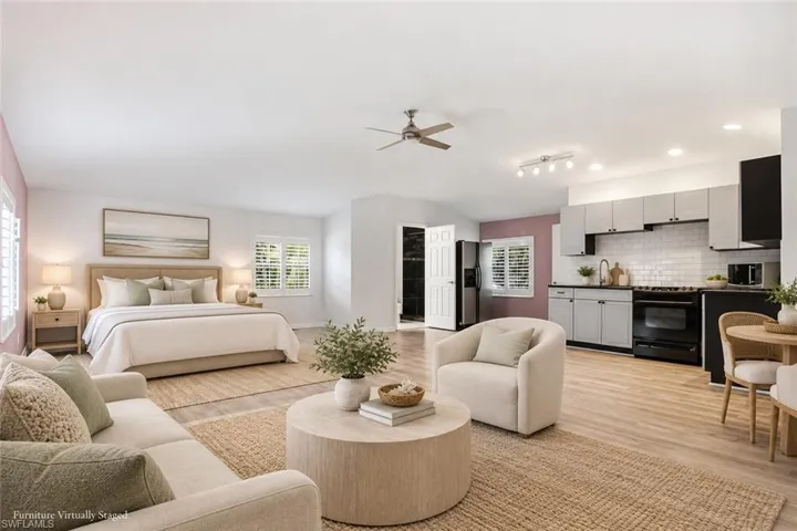 CONCRETE BLOCK DETACHED GARAGE WITH ROOM FOR 4 CARS + UPSTAIRS APARTMENT!Furniture in photo is virtually staged***