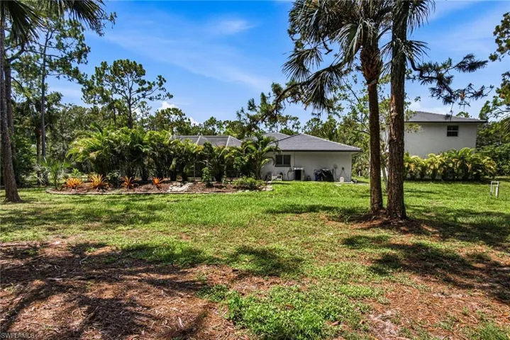 SPACE & NATURE with mature landscaping and fruit trees, while remaining minutes from Coconut Point, The Promenade, beaches, shopping & dining.