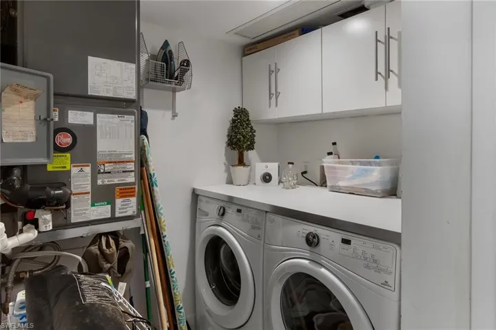 Bathroom with vanity, a stall shower, and backsplash