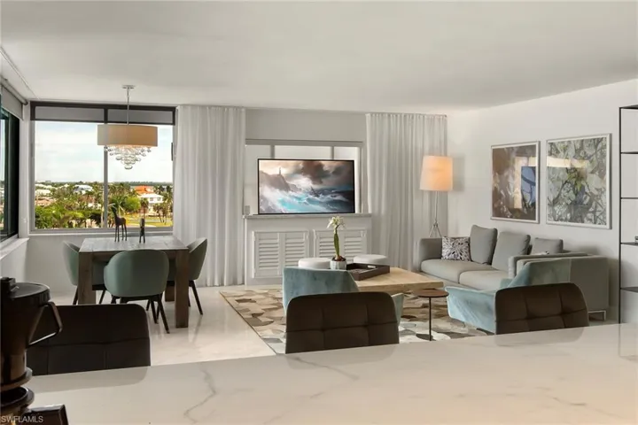 Dining space with baseboards and light tile patterned flooring