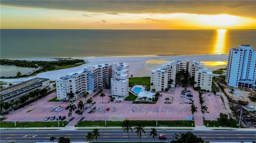 Aerial view of apartment complex and unending shoreline
