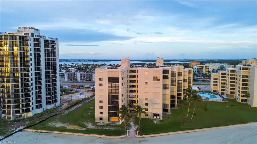View of apartment building / complex featuring a water view