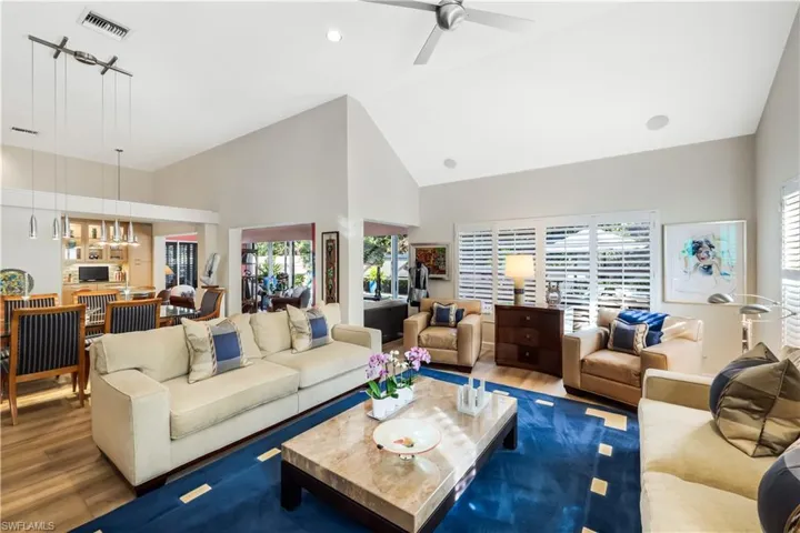 Vaulted ceiling with recessed lighting and ceiling fan