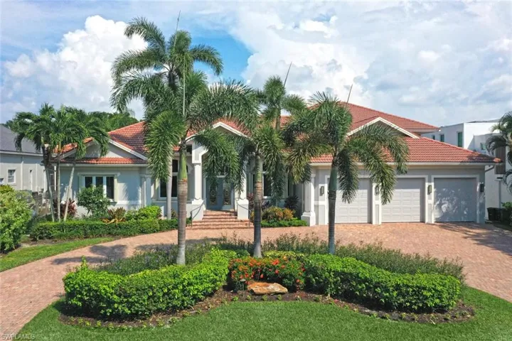 Mediterranean / spanish-style house with a garage