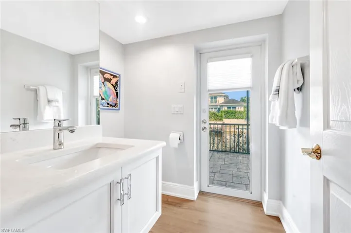 Bathroom featuring vanity and hardwood / wood-style flooring
