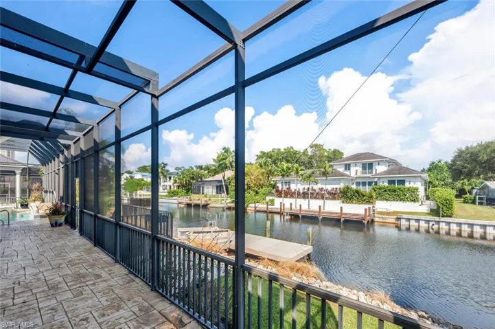 Sunroom / solarium with a water view