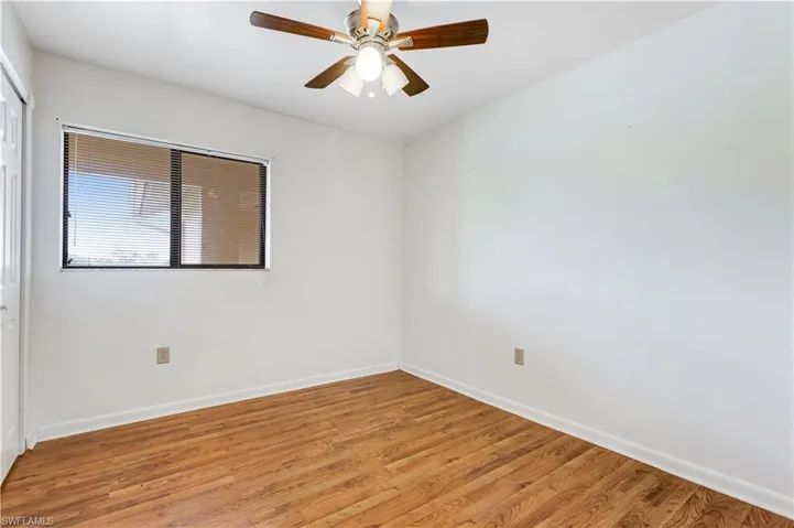Empty room featuring light hardwood / wood-style floors and ceiling fan