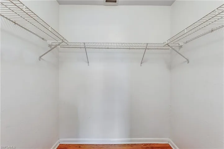 Walk in closet featuring hardwood / wood-style flooring