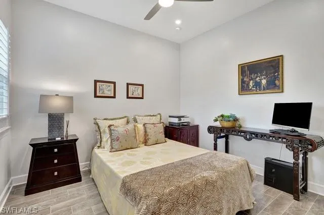Original third bedroom featuring porcelain tiled floors,  ceiling fan, and recessed lighting