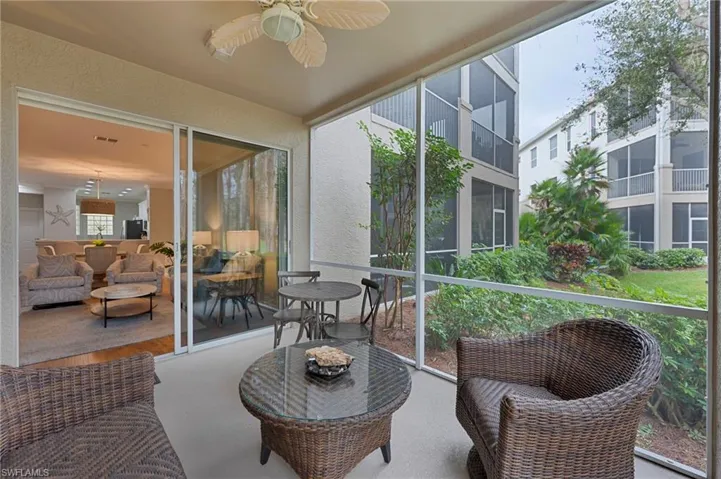 Sunroom / solarium featuring ceiling fan and outdoor lounge area