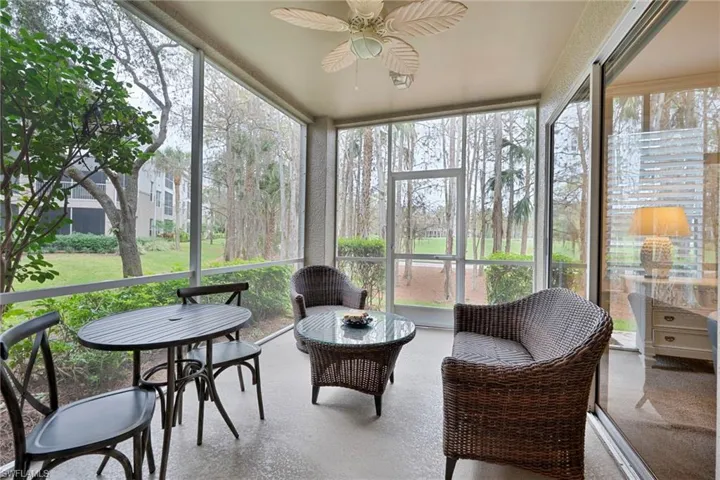 Sunroom featuring a ceiling fan