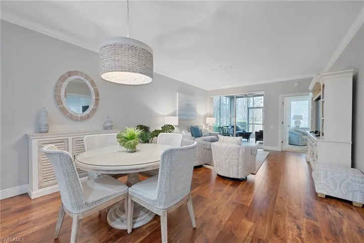 Dining room featuring crown molding and wood finished floors